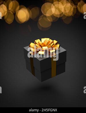 Una scatola presente scura con nastro dorato e arco che si sovrappone ad uno sfondo di pietra nera. Il bokeh si illumina sullo sfondo Foto Stock