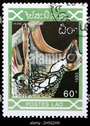 LAOS - CIRCA 1993: Un francobollo stampato in Laos mostra Sunda Flying Lemur, galeopterus variegatus, originario del sud-est asiatico, circa 1993 Foto Stock