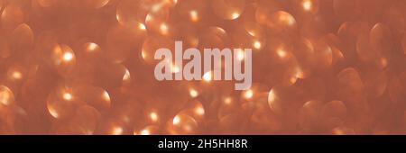 Bokeh arancione sfocato, cerchio sfondo luce astratta, luci scintillanti, scintillante giorno di San Valentino, giorno delle donne, evento luci sfondo romantico.sfondo vacanza astratto sfocato. Foto Stock