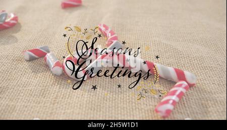 Immagine di stagioni saluti testo su caramelle canne Foto Stock