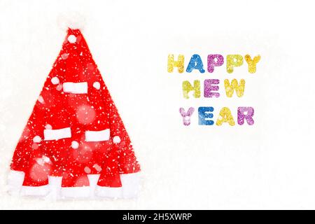 L'iscrizione Happy New Year su sfondo bianco, albero di Capodanno da caps di Capodanno Foto Stock