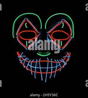 LED Scary Clown Mask che si illumina in rosso, verde e blu. Foto Stock