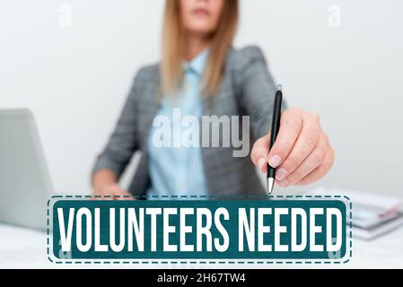 Scrittura visualizzazione testo Volontarii necessari. L'approccio aziendale necessita di lavoro o aiuto per l'organizzazione senza essere pagato dando a New Acres Company Foto Stock