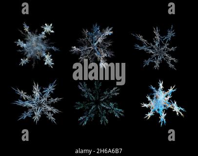 Vari fiocchi di neve su sfondo nero, rendering 3d Foto Stock