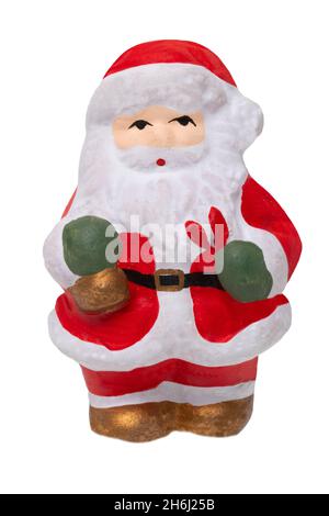 Babbo Natale isolato. Primo piano di una ceramica dipinta Padre Natale o la figura di San Nicola isolato su uno sfondo bianco. Decorazioni di Natale Foto Stock