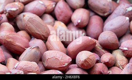 Sfondo di arachide placer snack luminosi; primo piano Foto Stock