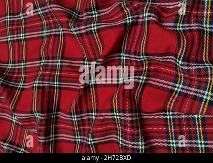 Tessuto uniforme per scuola di lana in tartan rosso. Classico scozzese in flanella senza cuciture. Modello onda tradizionale per uno sfondo di Natale o. Foto Stock