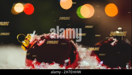 Immagine del testo jolly in ripetizione sopra i baubles di natale Foto Stock