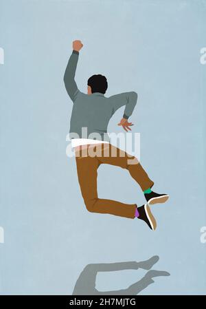 L'uomo felice che salta per gioia Foto Stock