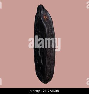 Primo piano fagiolo tonka nero su sfondo rosa Foto Stock