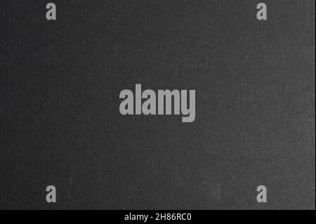 Vista ravvicinata macro fondo carta grigio piatta. Grana carta opaca Foto Stock