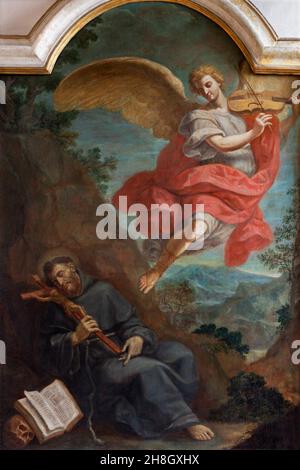 FERRARA, ITALIA - 9 NOVEMBRE 2021: Il dipinto della visione San Francesco d'Assisi con l'angelo che suona violino nella chiesa Chiesa di San Francesco Foto Stock