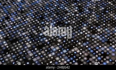 Sfondo astratto da di icone piccole simboli. Animazione. Ampia gamma di icone al neon che emoji si illuminano su sfondo nero. Collage di caratteri in c Foto Stock