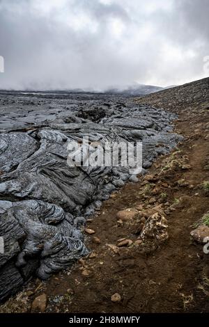 Campo di lava, flusso di lava e lava, Fagradersfjall, sistema vulcanico di Krysuvik, Penisola di Reykjanes, Islanda Foto Stock