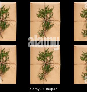 Confezione regalo ecologica in carta kraft motivo senza cuciture su sfondo nero. Stile ecologico naturale. Composizione con presente decorata con Christm Foto Stock