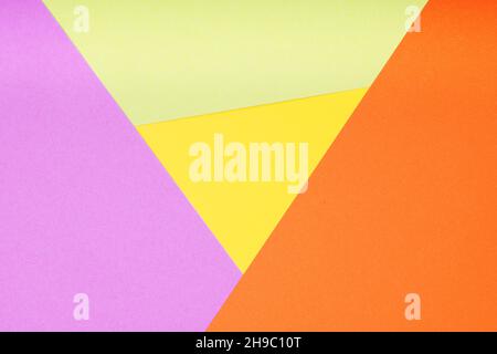 sfondo in carta multicolore con 4 colori diversi in forma triangolare e rombo Foto Stock