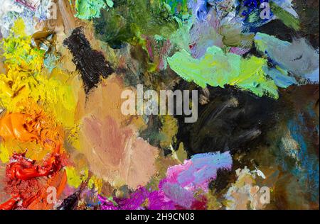 Vernice ad olio su tavolozza di legno colorata. Arte astratta con pittura ad olio Foto Stock