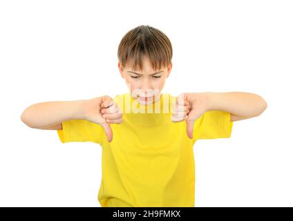 Sad Kid mostra Thumbs Down Gesture sullo sfondo bianco Foto Stock