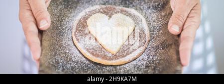 Banner intestazione casa torta da forno con simbolo di focolare su di esso. Concetto di cottura delle torte con amore Foto Stock