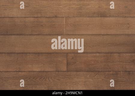 Moderno parquet in legno con motivi stilosi, pavimento in legno su sfondo. Vista dall'alto Foto Stock