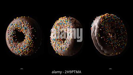 ciambelle al cioccolato con spolverette multicolore levitate su sfondo nero, set Foto Stock