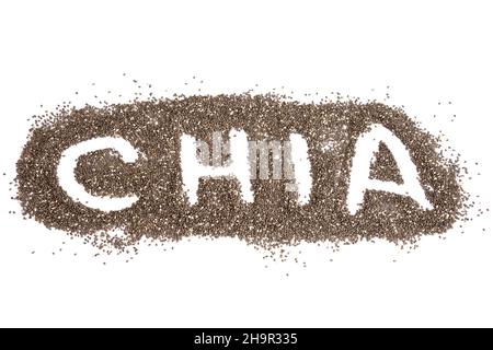 Parola CHIA scritto su uno sfondo di semi sparsi su una tavola bianca Foto Stock