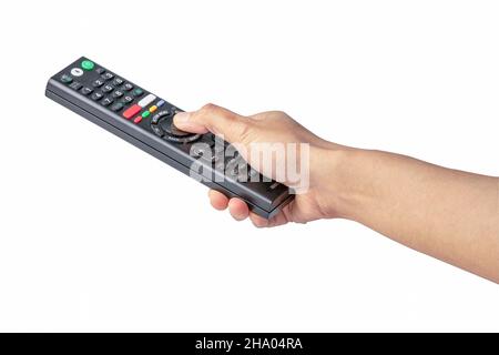 Televisore con telecomando e pressione manuale con percorso di ritaglio isolato su sfondo bianco. Foto Stock