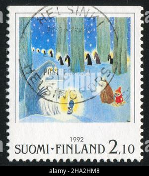 FINLANDIA - CIRCA 1992: Timbro stampato dalla Finlandia, mostra i personaggi Moomin nella foresta invernale, circa 1992 Foto Stock