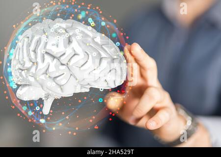 Computer engineer che tocca un rendering 3D di un ologramma cerebrale con punti interconnessi Foto Stock