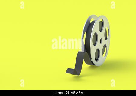 Bobina in metallo su sfondo giallo. Nastro per cinematografia. Tecnologia retrò. Prima cinema. Riprese documentarie. Spazio di copia. 3d rendering Foto Stock