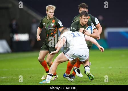 Swansea, Regno Unito. 12th Dic 2021. Ospreys centro Michael Collins durante la Ospreys v sale Sharks European Champions Cup Rugby Match. Credit: Gruffydd Thomas/Alamy Live News Foto Stock