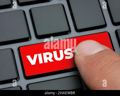 Chiudere il dito premendo il tasto rosso del virus sulla tastiera del computer Foto Stock