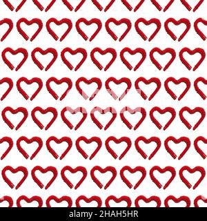 Modello senza cuciture con tubo per bambini rosso pop allungato piegato a forma di cuore. Giocattolo antistress in plastica tagliato fuori con la sua ombra dura su Whi Foto Stock