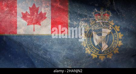 Vista dall'alto della bandiera retrò della Canada Border Services Agency, Canada con grana grunge. Patriota canadese e concetto di viaggio. Nessun flagpole. Design piano, l Foto Stock