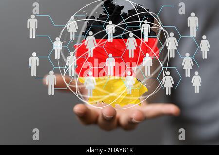 3D carta tedesca resa hovering sulla mano di una persona Foto Stock