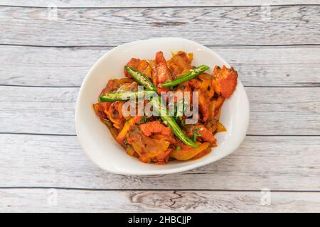 Jalfrezi significa frittura rapida, nata come piatto piccante dell'era britannica del Raj, cucinata con pollo, peperoni, cipolle, peperoncini verdi, ora è uno dei th Foto Stock