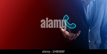 Businessman uomo tenere telefono Icon.Call Now Business Communication Support Center Customer Service Technology Concept Foto Stock