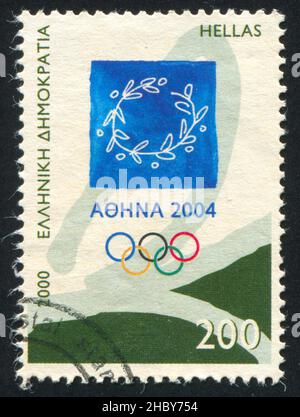 GRECIA - CIRCA 2000: Francobollo stampato dalla Grecia, mostra emblema dei Giochi Olimpici di Atene 2004, circa 2000 Foto Stock