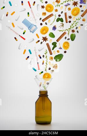 Medicina di erbe vs medicina chimica sfondo bianco - farmaci vs erbe Foto Stock