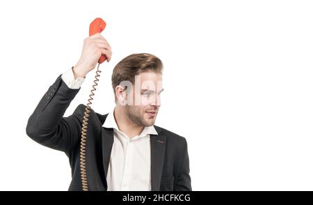 Il responsabile serio della chiamata telefonica tiene il ricevitore vecchio-stile del telefono vintage, la comunicazione telefonica Foto Stock