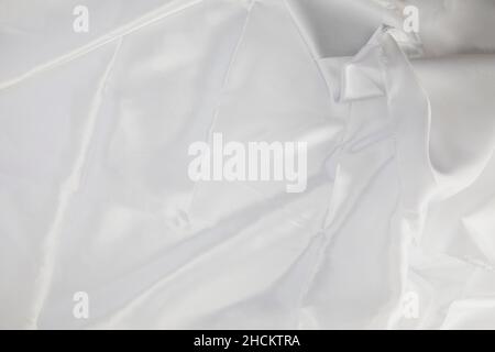 Elegante texture di sfondo romantico in seta bianca liscia. In tonalità seppia. Stile retrò di colore naturale Foto Stock