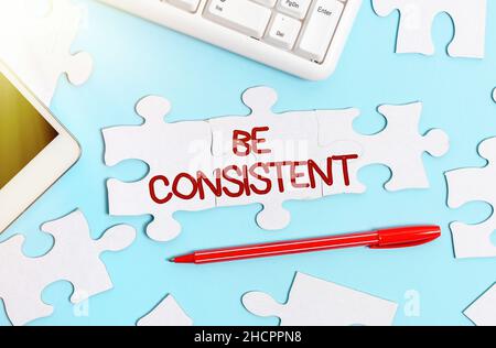 La visualizzazione concettuale sia coerente. Word for Uniform persistente azienda inalterabile anche immutabile Rapport costruire un bianco incompiuto Jigsaw Pattern Foto Stock