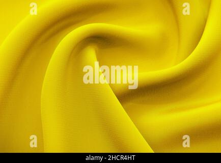 Sfondo da un pezzetto di tessuto giallo con onde. Tessile. Materiale da cucire Foto Stock