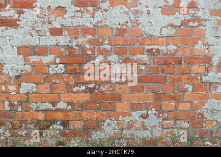 Vecchio sfondo muro di mattoni rosso con intemperie Foto Stock