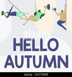 Cartello con la scritta Hello Autumn. Concetto di business che il tempo comincia ad ottenere più freddo e alberi versano le loro foglie persone che disegnano Hanging al soffitto con Foto Stock