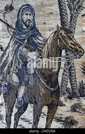 Cavaliere orientale con fucile su una coperta in tessuto Art Deco Foto Stock