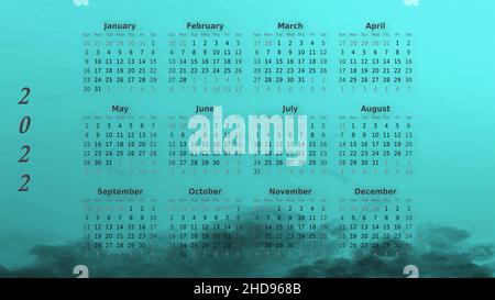 Calendario 2022, fissato per 12 mesi. Fumo su sfondo turchese Foto Stock