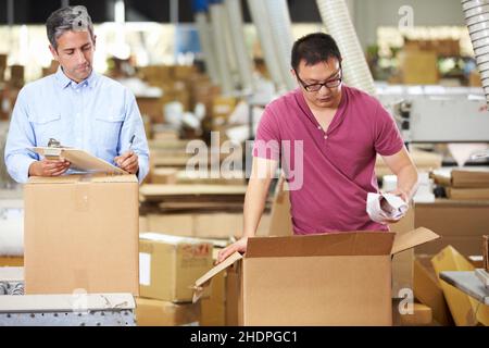 logistica, imballaggio, addetto al magazzino, società di ordini postali, logistica, addetti al commercio e al magazzino Foto Stock