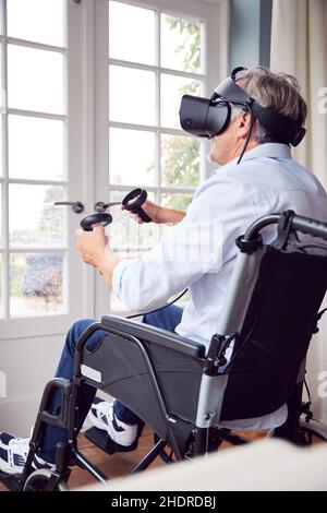 realtà virtuale, sedia a rotelle, videogioco, simulazione, realtà simulata al computer, multimedia immersiva, simulatori di realtà virtuale, realtà virtuale, sedie a rotelle, Foto Stock