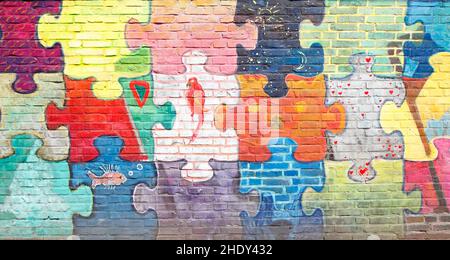 dipinto, muro di mattoni, pezzi di puzzle, pittori, muri di mattoni, pezzo di puzzle Foto Stock